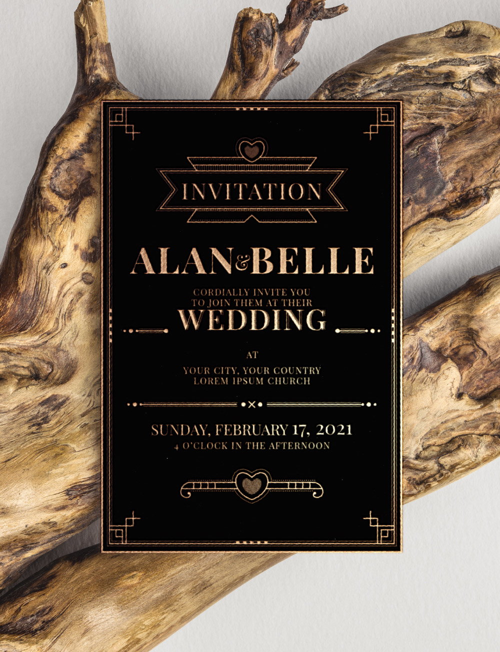 Black and golden wedding invitation Black and golden wedding invitation template kept against a tree bark