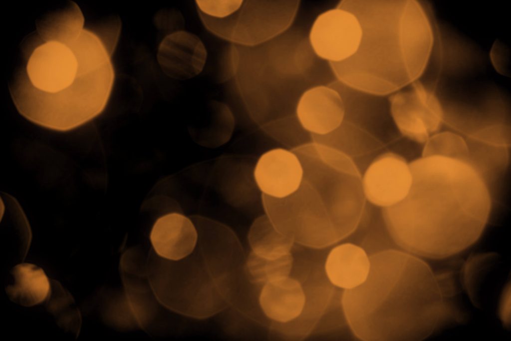 Luminous orange lights in the dark background