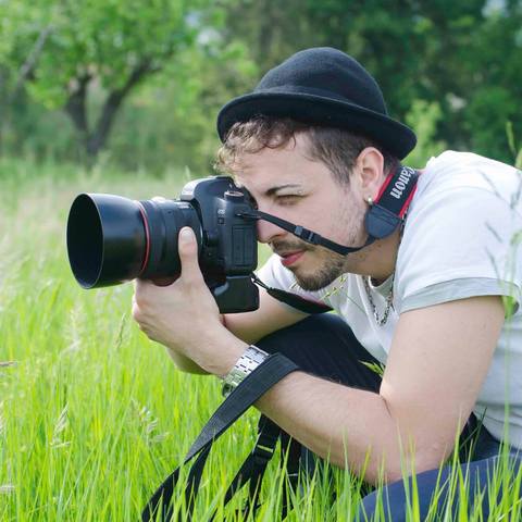 A man clicking a photo in a jungle