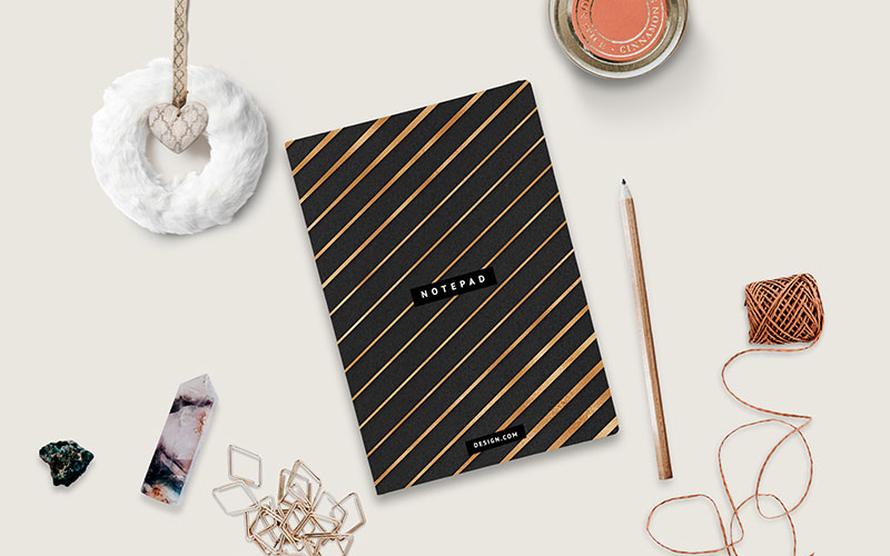 black and gold background on a notebook mockup