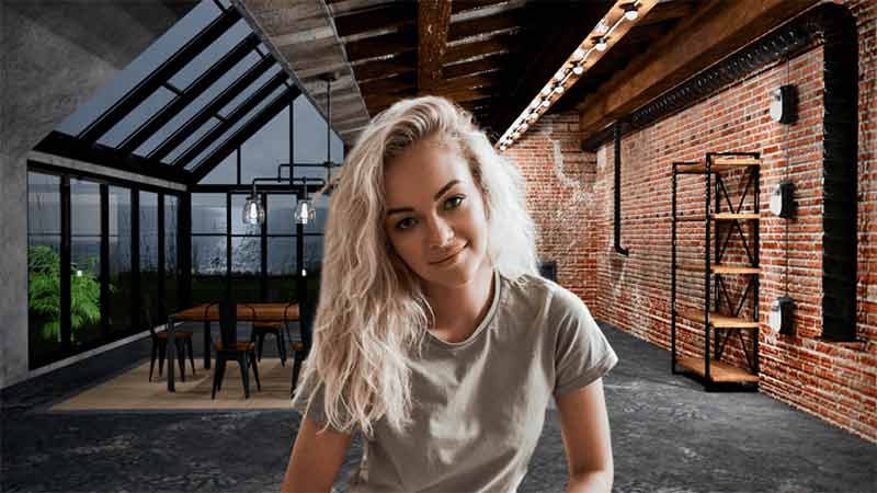This picture showcases a woman with blonde hair sitting in a living room