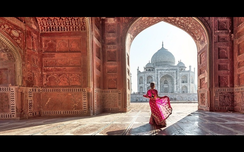 A woman in pink standing against Taj Mahal after using HDR 9 Pro - Create High Resolution Images