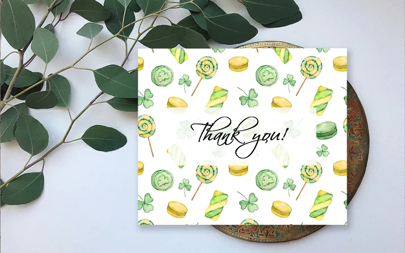Digital thank you card featuring a watercolor St Patricks Day pattern with green treats and shamrocks.