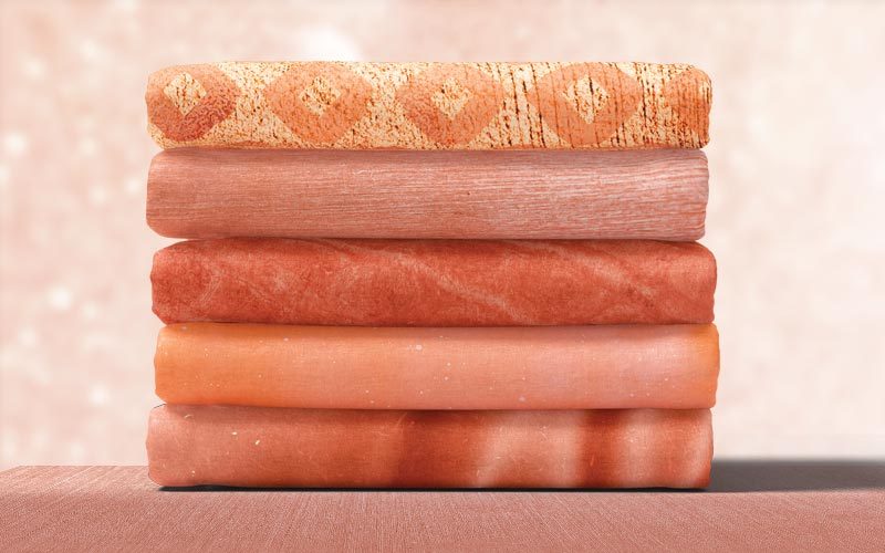 rose gold wallpaper piled one on top of another